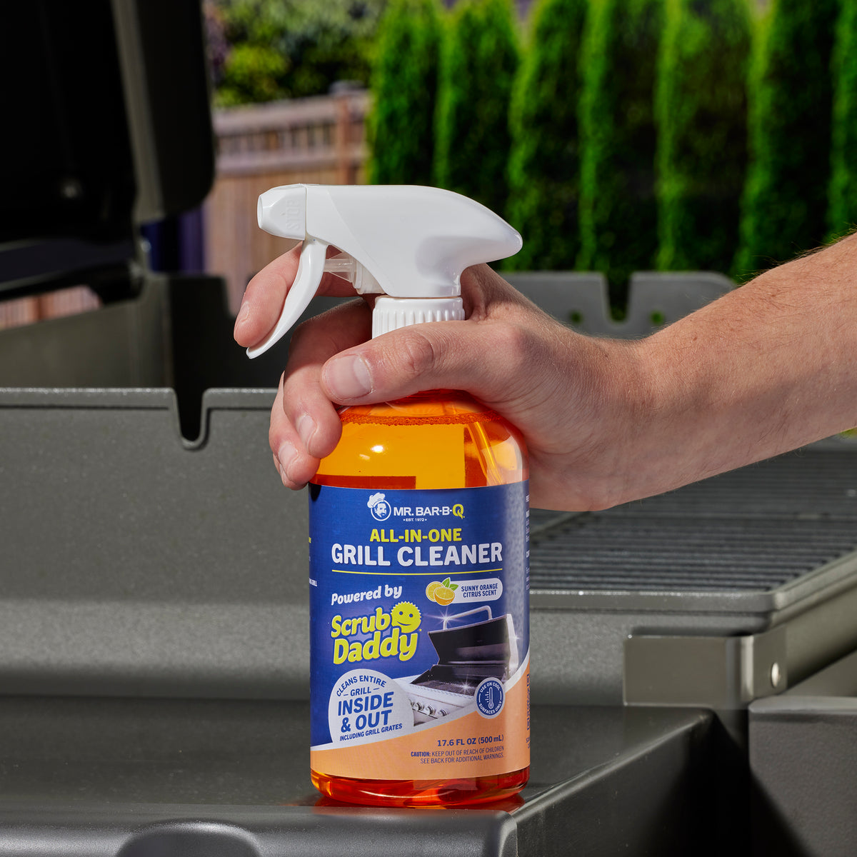 Mr. Bar-B-Q All-In-One Grill Cleaner bottle powered by Scrub Daddy with sunny orange citrus scent, shown in a 17.6 fl oz spray bottle, designed for cleaning grills inside and out, including grates.