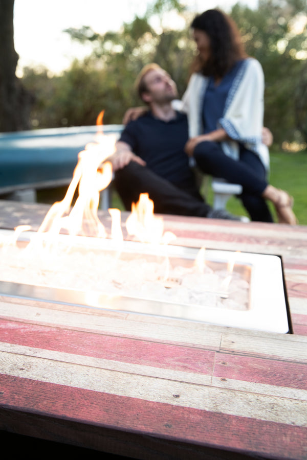 The Americana 40 x 28 Inch Rectangular 40,000 BTU Patio Outdoor LP Gas Fire Pit w/White Fire Glass, American Flag Mantel, and Cover